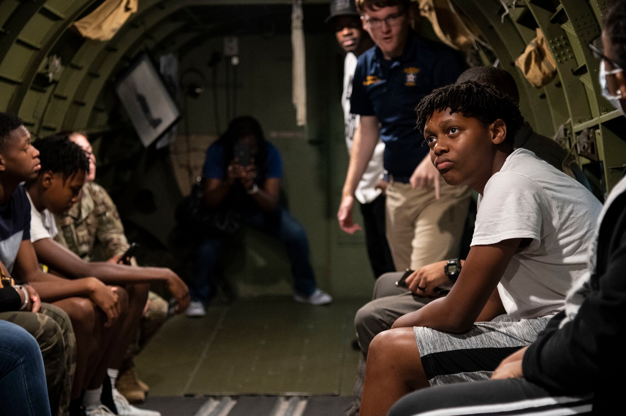 An Organization of Black Aerospace Professionals student learns about the C-47A Skytrain during an immersion tour at the Air Mobility Command Museum in Dover, Delaware, June 21, 2022. OBAP aims to motivate youth to become educationally prepared for life, increase minority participation in aerospace and increase the number of minority professionals in aerospace and related industries. (U.S. Air Force photo by Staff Sgt. Marco A. Gomez)