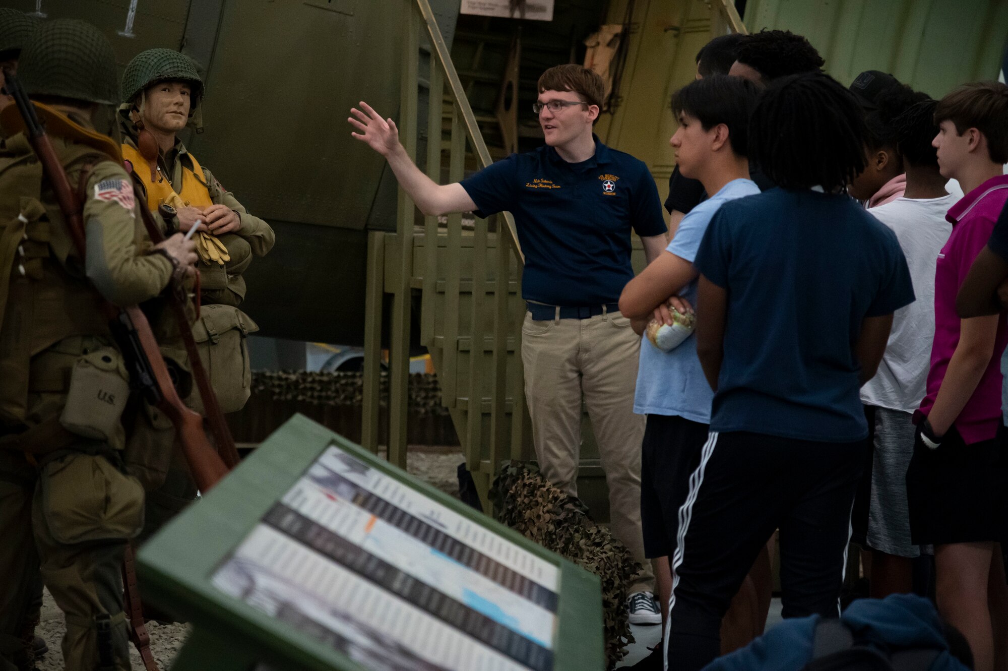 Nick Sabaria, Air Mobility Command Museum tour guide, briefs students from the Organization of Black Aerospace Professionals during an immersion tour at the Air Mobility Command Museum in Dover, Delaware, June 21, 2022. OBAP aims to motivate youth to become educationally prepared for life, increase minority participation in aerospace and increase the number of minority professionals in aerospace and related industries. (U.S. Air Force photo by Staff Sgt. Marco A. Gomez)