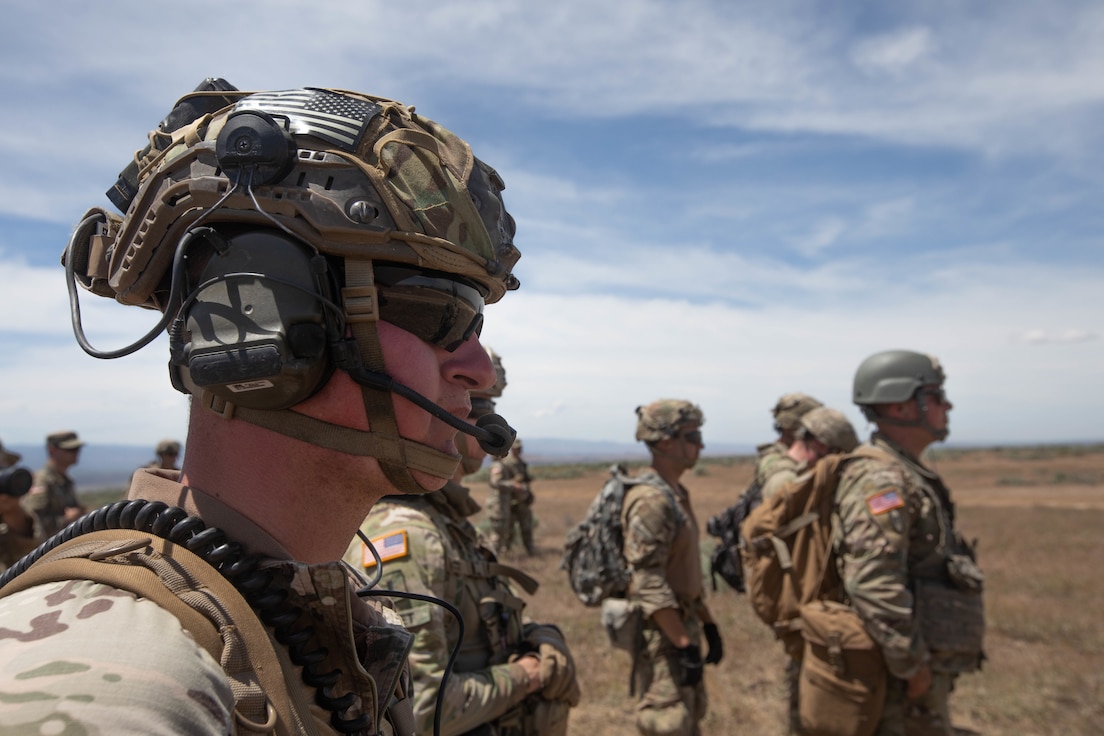 Forward observers await UH-60 helicopters for transport to new observation areas for training on marking artillery targets during Western Strike 22, June 9, 2022.