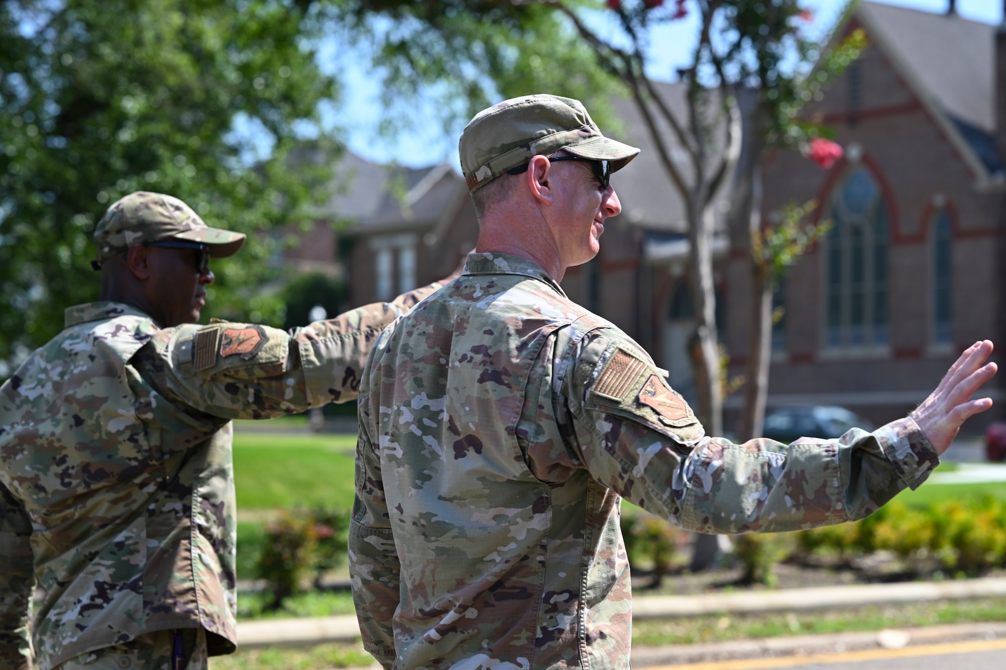 U.S. Air Force Col. Seth Graham, 14th Flying Training Wing commander and Chief Master Sgt. Antonio Cooper 14FTW command chief, wave as the pass by a crowd during the 25th Annual Juneteenth Parade, June 18, 2022, in Downtown Columbus. Juneteenth honors the memory of June 19, 1865, when Union soldiers rode into Galveston, Texas and read President Abraham Lincoln’s Emancipation Proclamation to the public. (U.S. Air Force photo by Senior Airman Jessica Haynie