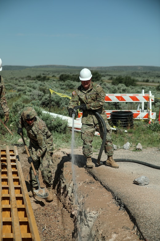 Horizontal construction engineers with the 116th Engineer Company, 1457th Engineer Battalion, Utah National Guard finalize the installation of a new cattle guard at Dinosaur National Monument, June 13, 2022