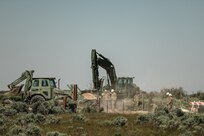 Horizontal construction engineers with the 116th Engineer Company, 1457th Engineer Battalion, Utah National Guard work on installing a new cattle guard at Dinosaur National Monument, June 13, 2022.