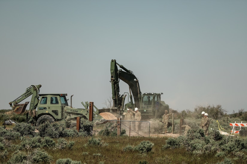 Horizontal construction engineers with the 116th Engineer Company, 1457th Engineer Battalion, Utah National Guard work on installing a new cattle guard at Dinosaur National Monument, June 13, 2022.