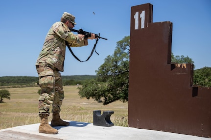 Spc. Sean Doyle, a squad member representing the U.S. Army South's best squad competition team puts on his M50 gas mask during the medical lane during the Army Futures Command 2022 Best Squad Competition on June 7, 2022 at Camp Bullis, Texas. The Best Squad Competition is being used to select the team that will represent their command at the next level of competition with the hope of eventually winning the inaugural U.S. Army level Best Squad Competition