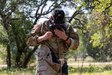 Spc. Sean Doyle, a squad member representing the U.S. Army South's best squad competition team puts on his M50 gas mask during the medical lane during the Army Futures Command 2022 Best Squad Competition on June 7, 2022 at Camp Bullis, Texas. The Best Squad Competition is being used to select the team that will represent their command at the next level of competition with the hope of eventually winning the inaugural U.S. Army level Best Squad Competition