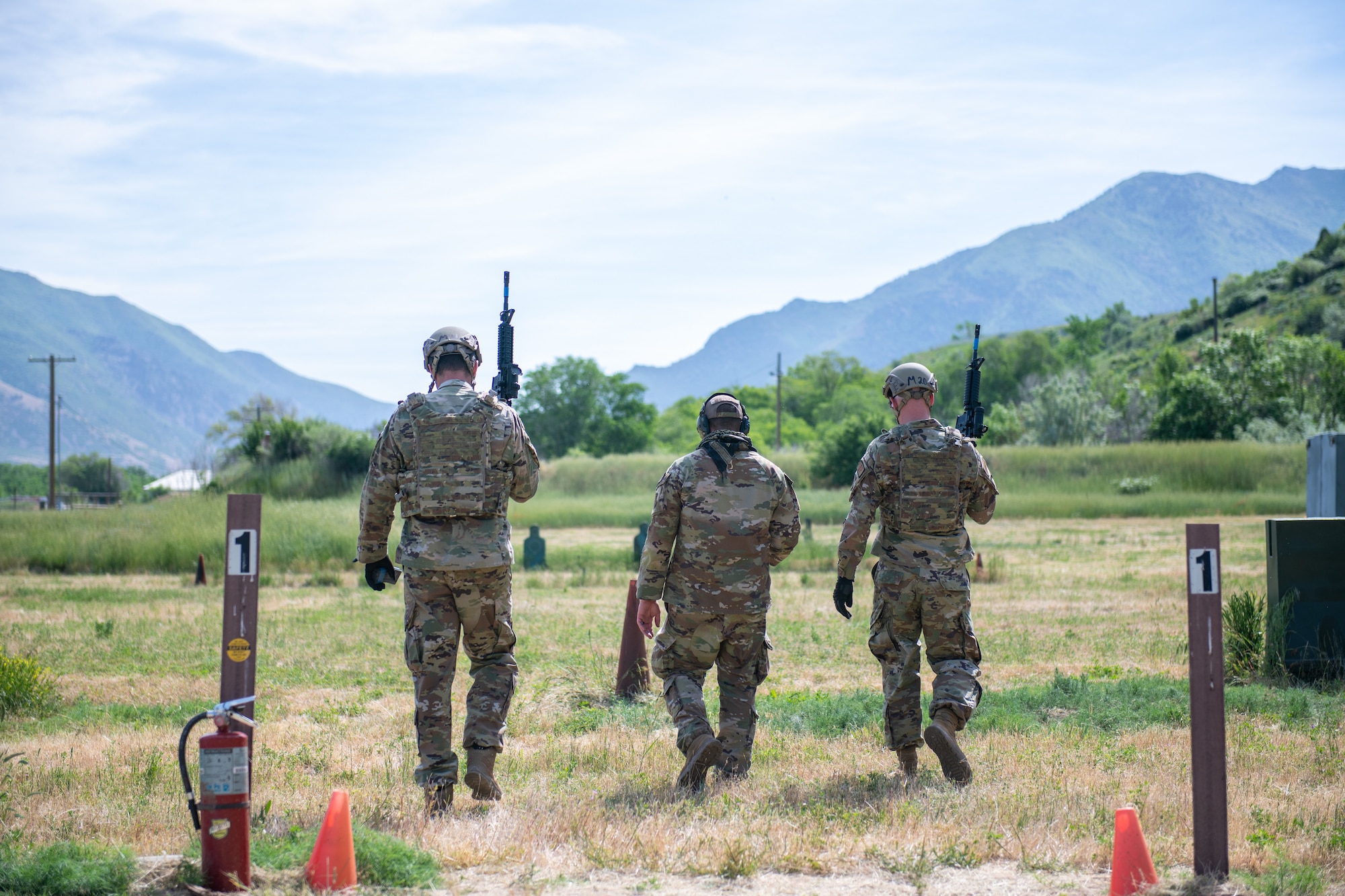 Combat arms instructors from the 419th Security Forces Squadron walk out onto the range before starting their “Shoot, Move, Communicate” training at Hill Air Force Base, Utah on June 11, 2022. The exercise is part of their annual weapons training plan, ensuring Airmen remain proficient in not only marksmanship, but how to move and communicate effectively when engaged with a target. (U.S. Air Force photo by Senior Airman Erica Webster)