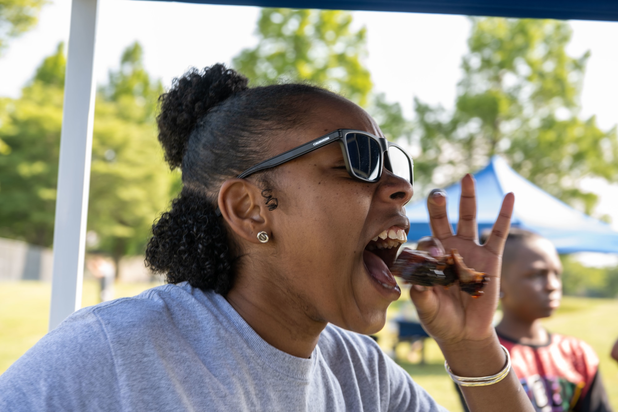 A judge for the grill masters competition tries a contestant’s rib during the Juneteenth Family Reunion event at Misawa Air Base, Japan, June 18, 2022.