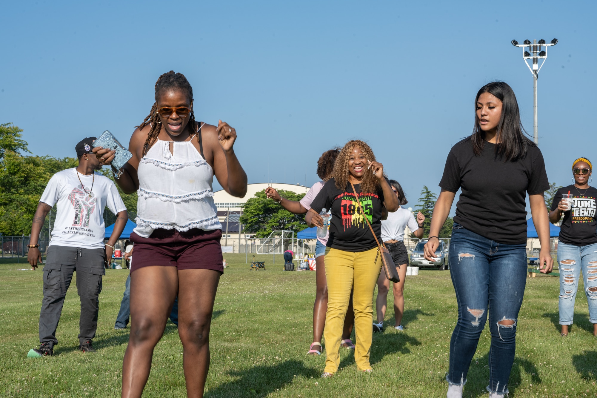 Members from Team Misawa dance during the Juneteenth Family Reunion event at Misawa Air Base, Japan, June 18, 2022.