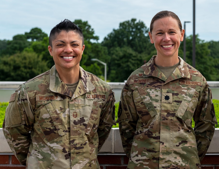 Master Sgt. Kayleigh McAviney, left, 335th Fighter Generation Squadron first sergeant, and her wife, Lt. Col. Hattie McAviney, 4th Operational Medical Readiness Squadron commander, pose for a photo together after Lt. Col. McAviney’s assumption of command at Seymour Johnson Air Force Base, North Carolina, August 6, 2021. The McAvineys are able to be married and receive all the benefits to which married service members are entitled because of the repeal of “Don’t Ask, Don’t Tell.” (U.S. Air Force photo by Senior Airman Kimberly Barrera)