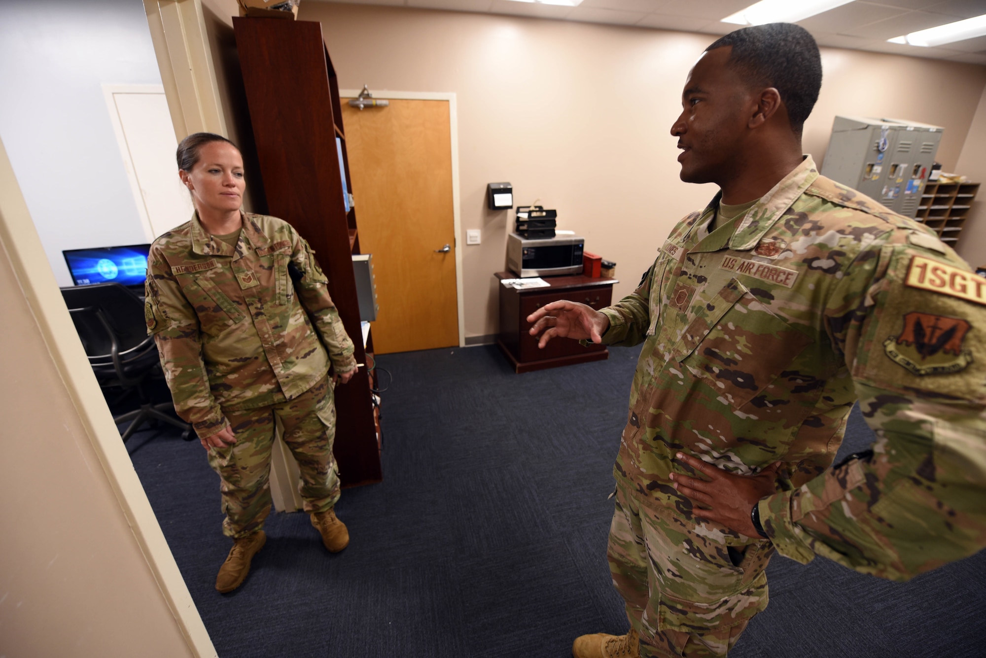 First sergeant talks to an Airman