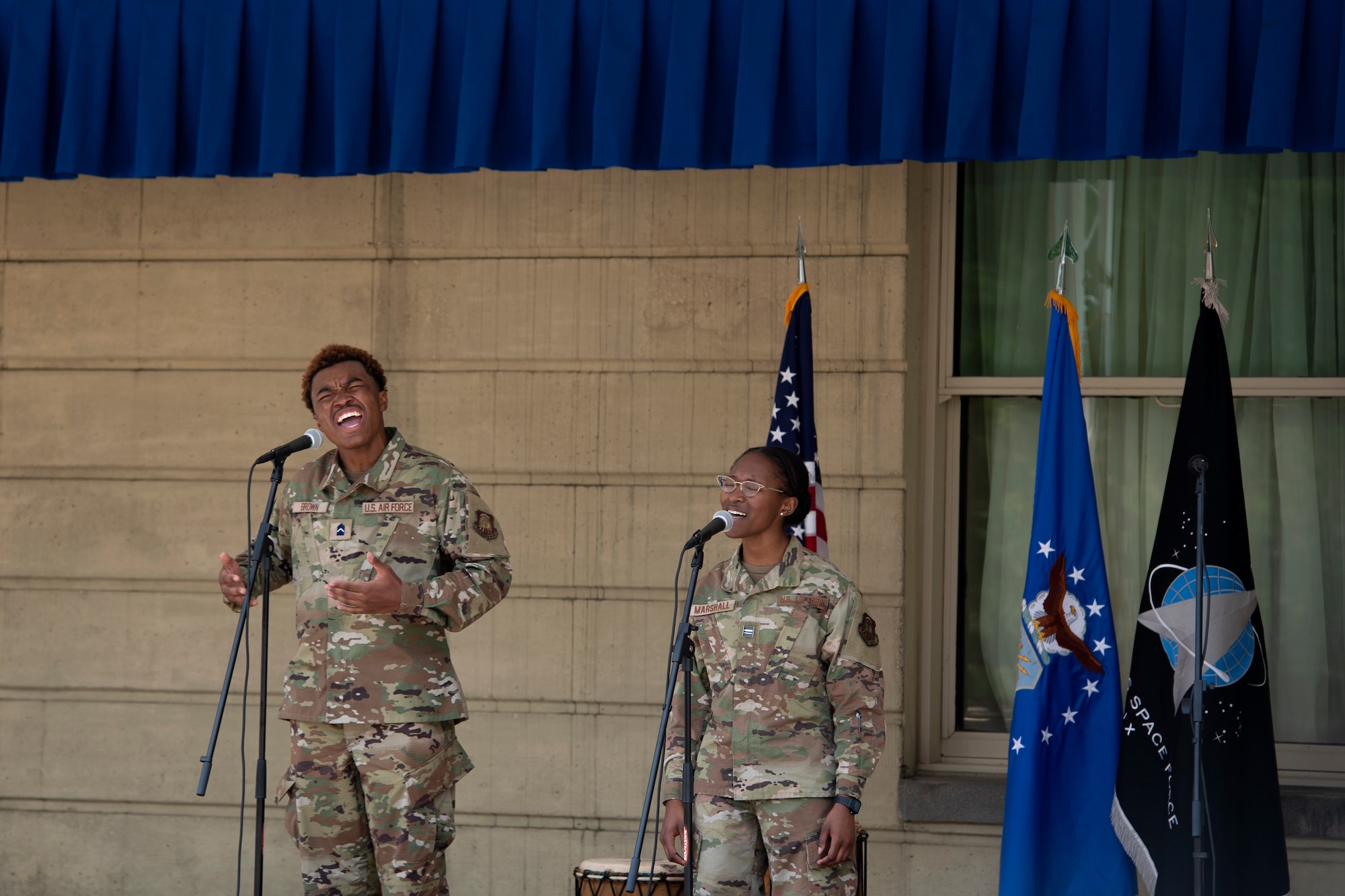 Kolby Brown and Amiah Marshall, Air Force cadets, sing during a Juneteenth Celebration at the Pentagon in Arlington, Va., June 21, 2022. The ceremony included a variety of special performances from Bowie State Gospel Choir, Hampton University Terpsichorean, Farafina Kan West African Percussion and Dance Ensemble, and other individual acts to celebrate Black heritage. (U.S. Air Force photo by Staff Sgt. Elora J. McCutcheon)