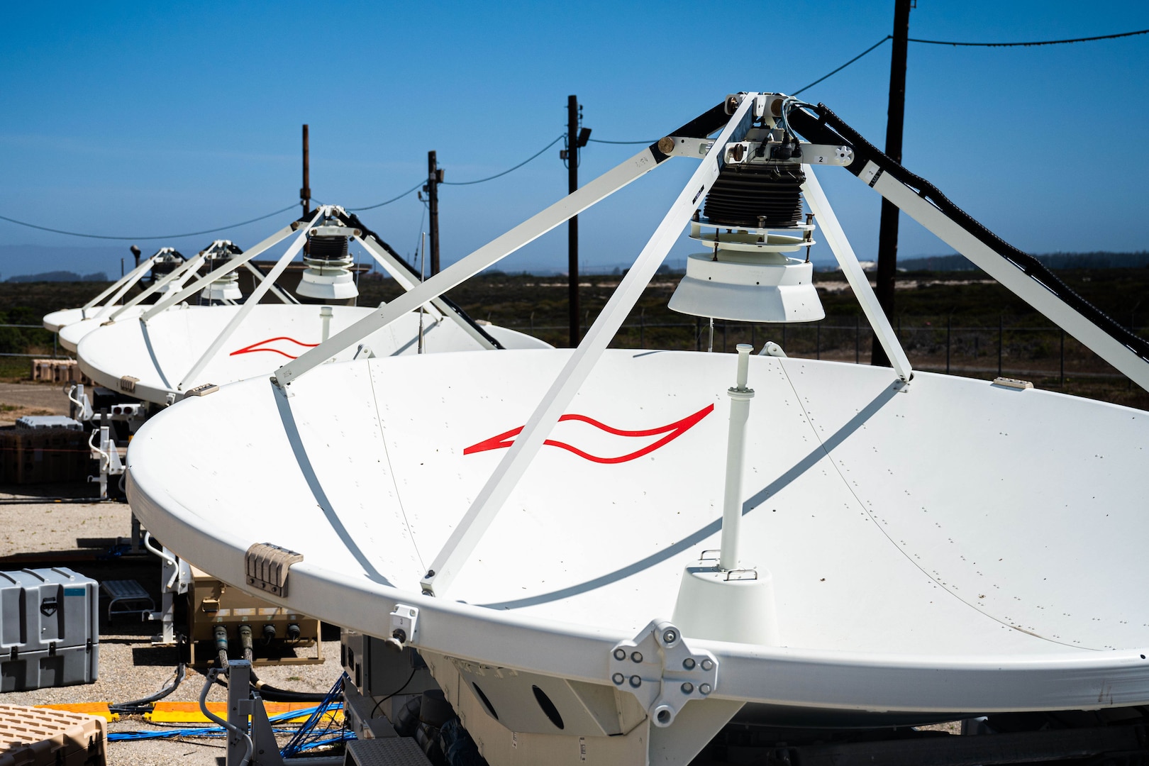 Four large multi-band antennas (LMAs), belonging to the 216th Space Control Squadron (SPCS), point to the sky July 7, 2022, at Vandenberg Space Force Base, Calif. The LMAs are one part of the 216 SPCS’s overall mission set involving warfare in the electromagnetic spectrum. (U.S. Space Force photo by Tech. Sgt. Luke Kitterman)