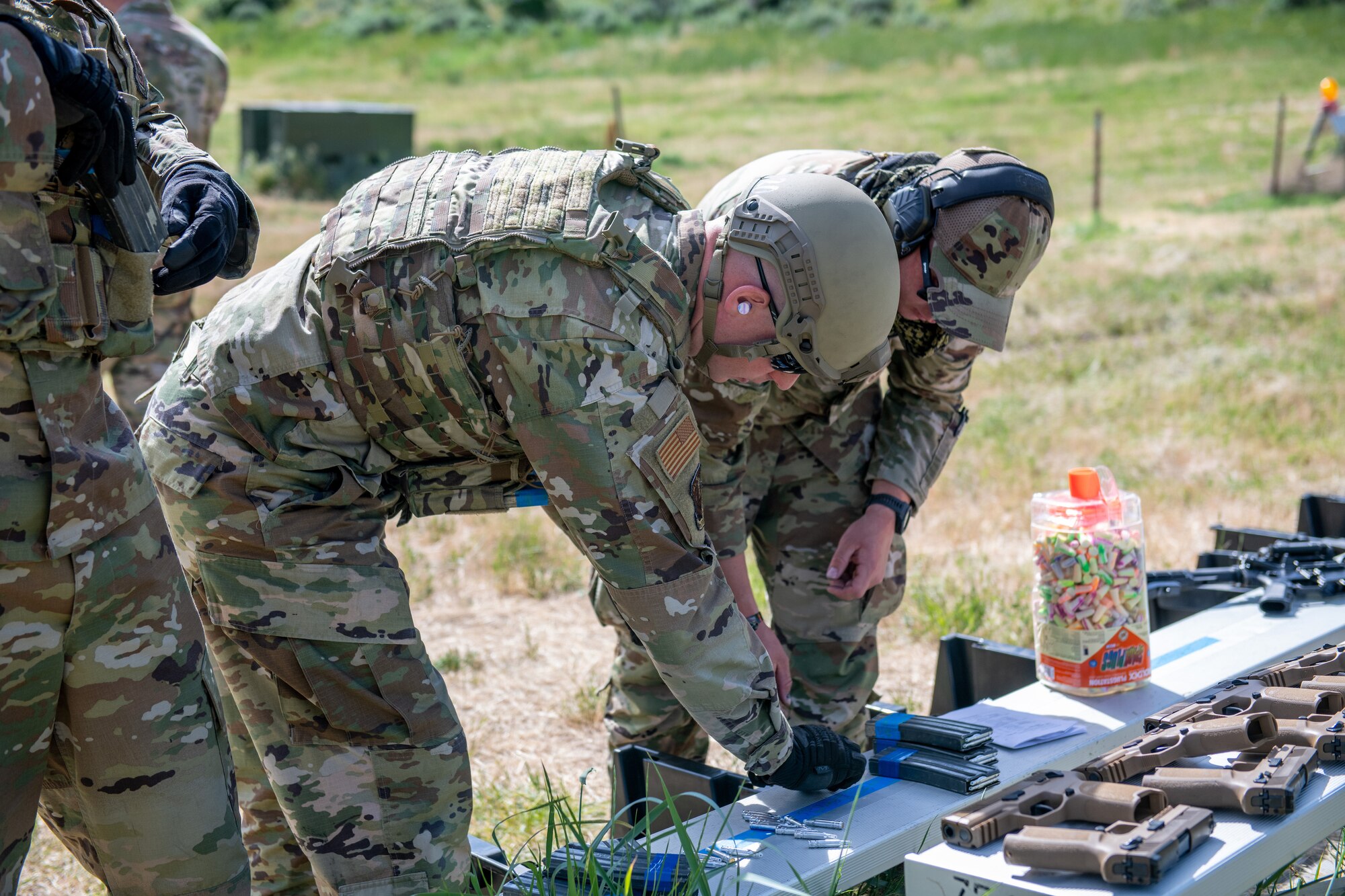 Staff Sgt. Tyrell Shepherd and Staff Sgt. Travis Webb, 419th Security Forces combat arms instructors, prepare for their “Shoot, Move, Communicate” exercise at Hill Air Force Base, Utah on June 11, 2022. The exercise is part of their annual weapons training plan, ensuring Airmen remain proficient in not only marksmanship, but how to move and communicate effectively when engaged with a target. (U.S. Air Force photo by Senior Airman Erica Webster)