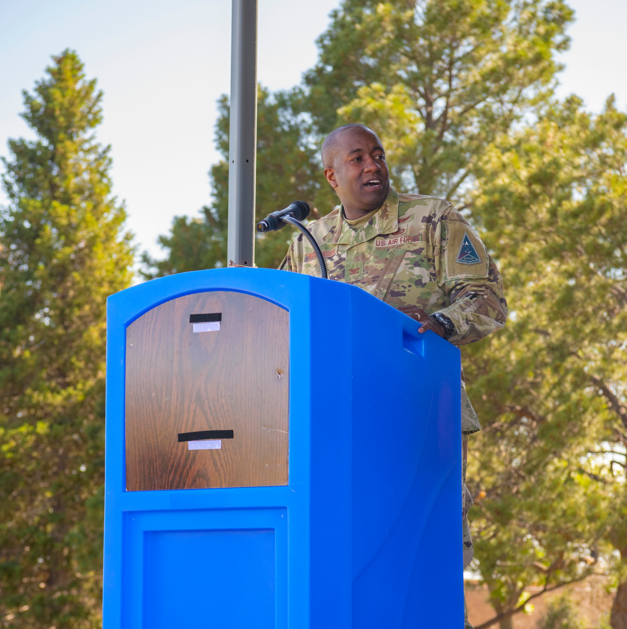 U.S. Air Force Col. Dennis Woodfork II, Space Base Delta 1, individual mobilization augmentee to the Commander, delivers a speech during the Juneteenth Festival at Peterson Space Force Base, Colorado, June 16, 2022.