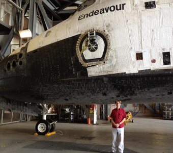 Figure 7: Ubelhor pictured in front of National Aeronautics and Space Administration (NASA) Space Shuttle Endeavour in 2012
