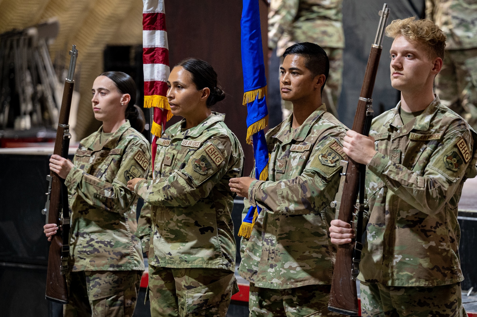 Staff Sgt. Taylor Solano, 332d Expeditionary Logistics Readiness Squadron Air Terminal Operations Center information controller and Base Honor Guard non-commissioned officer-in-charge, second from left, gives commands to the ceremonial detail during the master sergeant release ceremony at an undisclosed location in Southwest Asia, June 1, 2022. The Honor Guard provides military ceremonial support and dignified transfer support when called upon. (U.S. Air Force photo by Master Sgt. Christopher Parr)