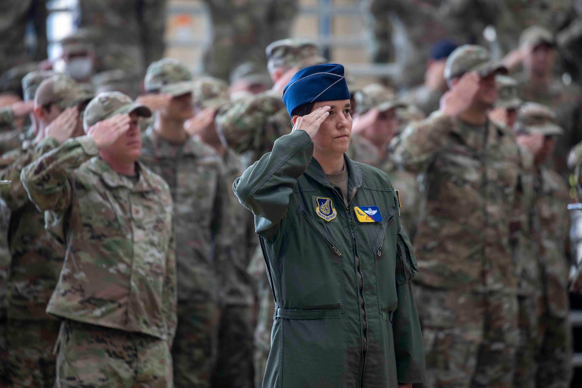 Members of the 374th Airlift Wing salute during the 374th Airlift Wing change of command ceremony