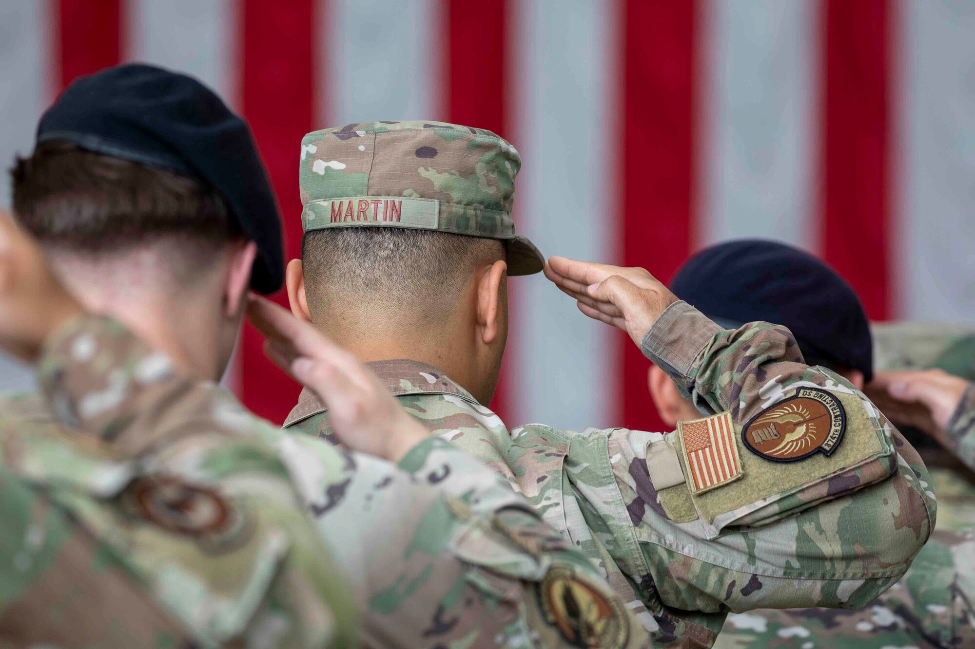 Members of the 374th Airlift Wing salute during the 374th Airlift Wing change of command ceremony