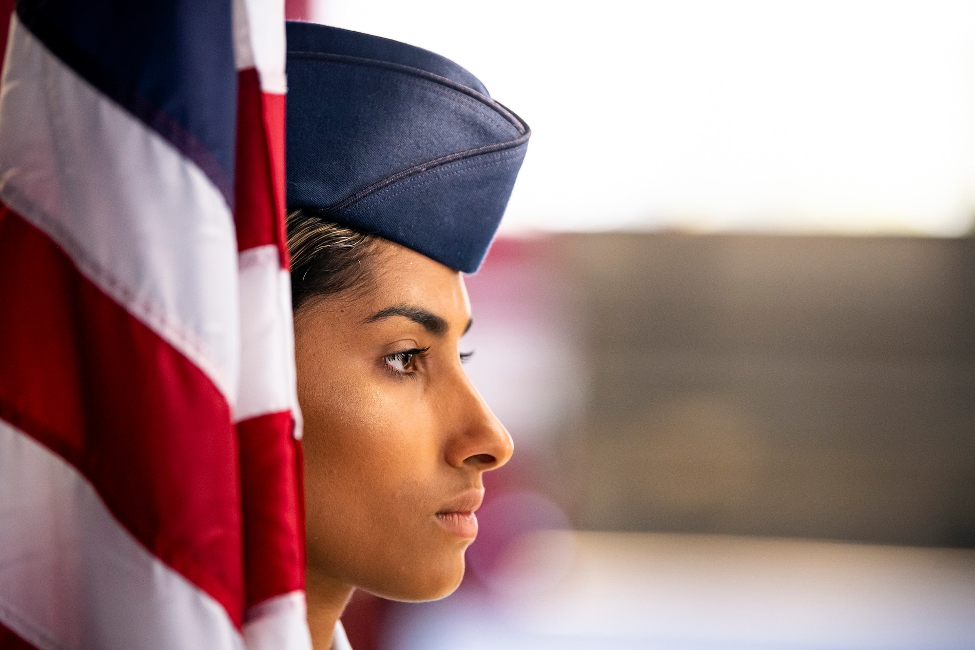 U.S. Air Force Staff Sgt. Naujy Serrano, 423d Civil Engineer Squadron emergency management NCO in charge of plans and operations, stands at attention prior to a change of command ceremony at RAF Alconbury, England, June 22, 2022. The ceremony is a military tradition that represents a formal transfer of a unit’s authority from one commander to another. (U.S. Air Force photo by Staff Sgt. Eugene Oliver)