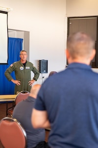 Rear Adm. Pete Garvin, commander, Naval Education and Training Command (NETC), speaks to learning standards officers (LSOs) at an offsite meeting aboard Naval Air Station Pensacola, June 16, 2022.