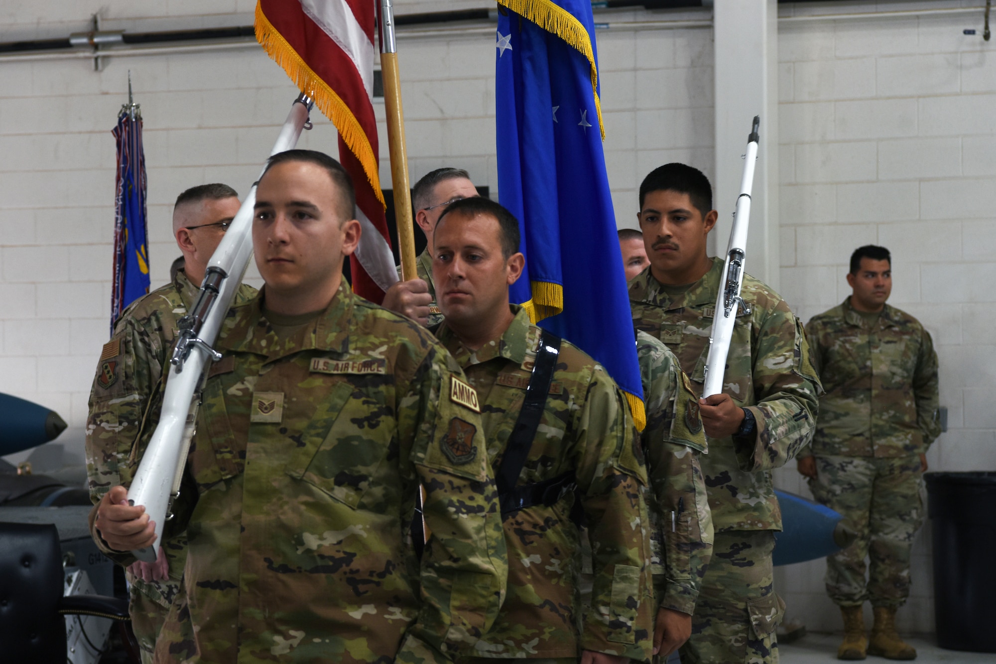 Members of the 7th Munitions Squadron honor guard march before presenting the colors on Dyess Air Force Base Texas, 16 Jun 2022. The mission of the 7th Munitions Squadron is to provide reliable munitions and release equipment. (U.S. Air Force photo by Senior Airman Sophia Robello)