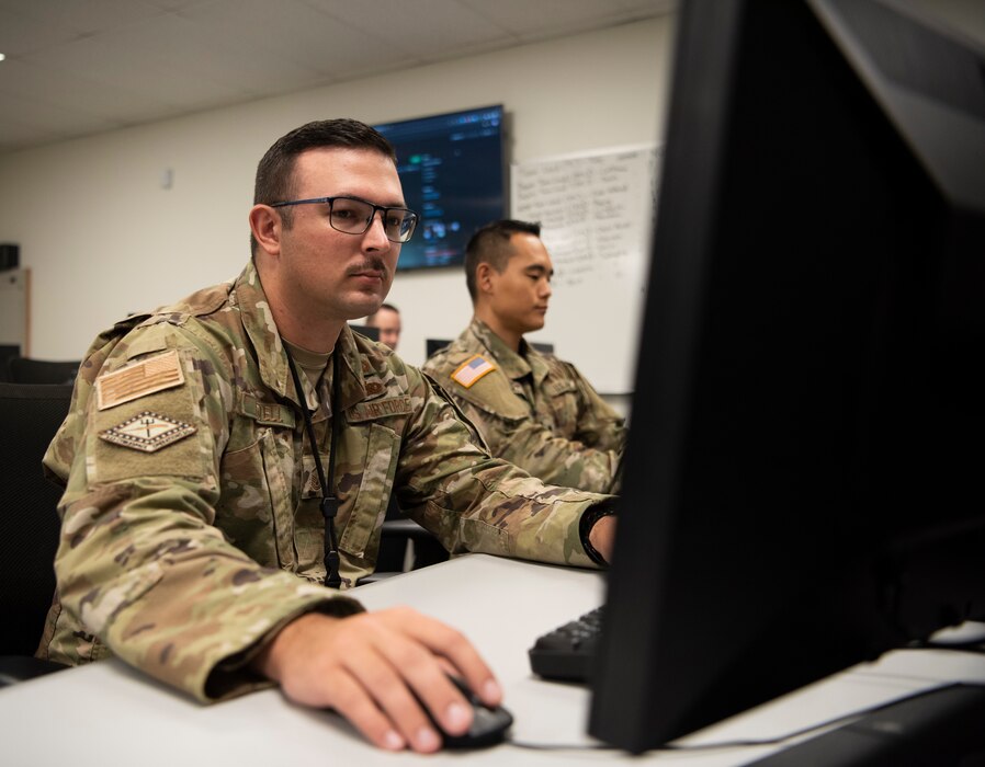 Master Sgt. Jonathan Lovell, 223rd Cyber Operations Squadron NCO in charge of cyber intelligence, works on a computer, June 16, 2022.