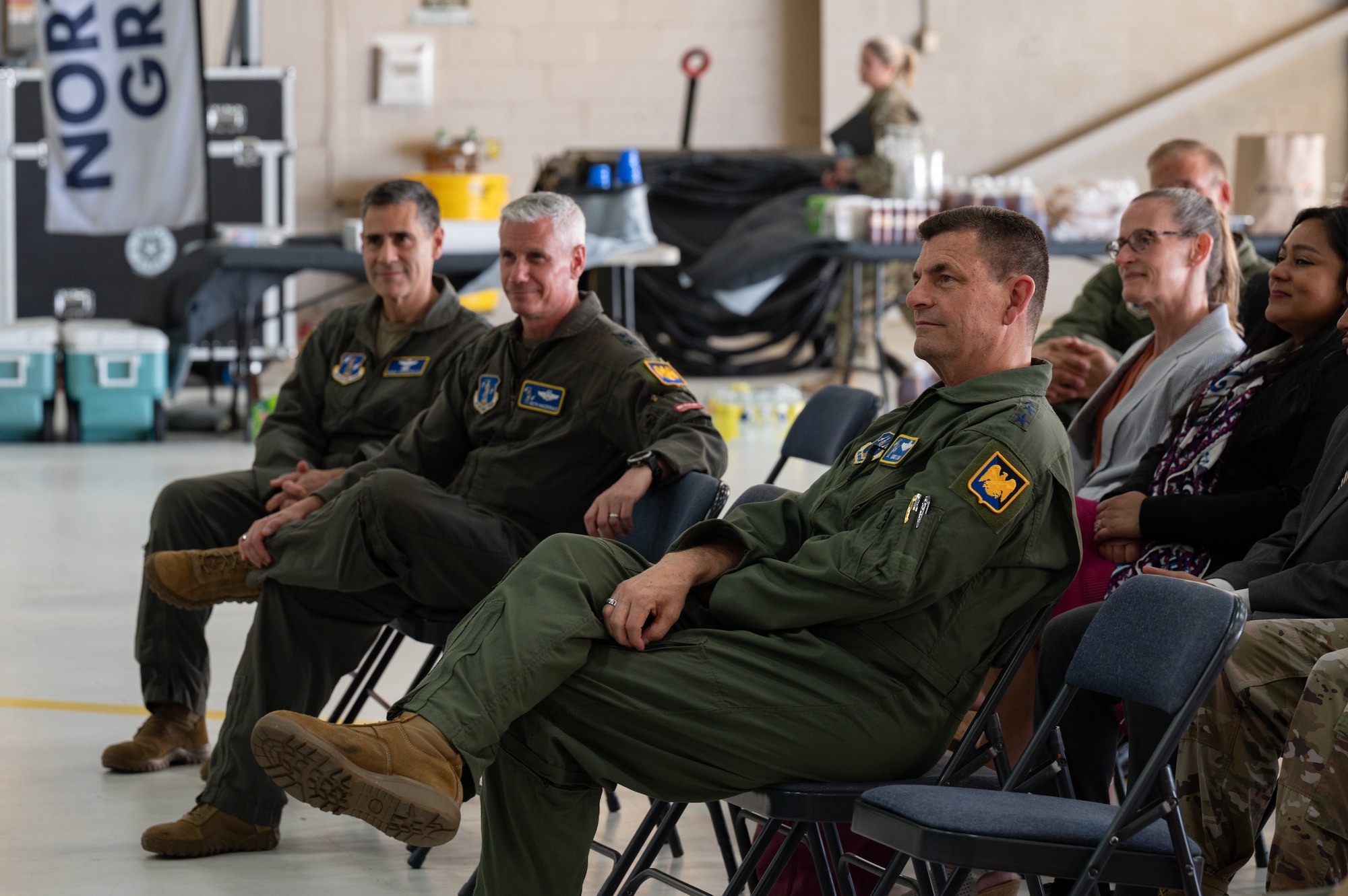 U.S. Air Force Lt. Gen. Michael A. Loh, right, director, Air National Guard, listens to speakers at a ceremony commemorating the Active Electronically Scanned Array radars now equipped on F-16 Fighting Falcon aircraft assigned to 113th Wing, District of Columbia National Guard, on Joint Base Andrews, Maryland, June 9, 2022.