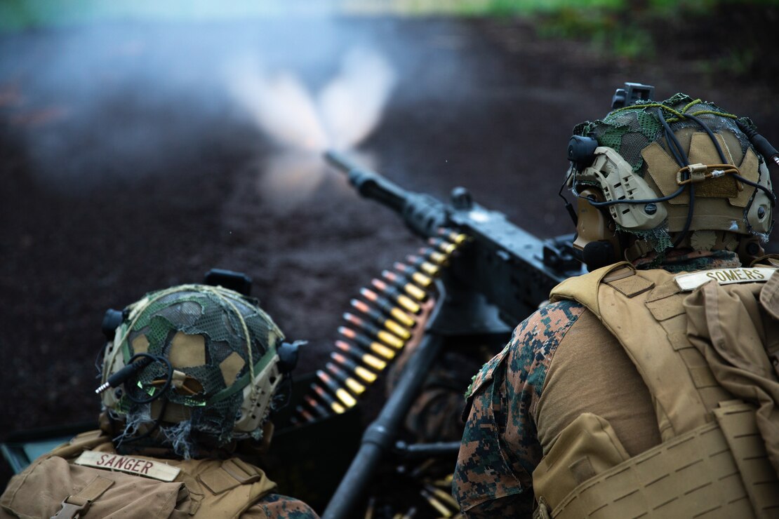 U.S. Marine Corps Lance Cpl. Christian Sanger and Cpl. Tyler Somers, both machine gunners with 3d Battalion, 2d Marines, fire an M2 machine gun during Exercise Shinka 22.1 at Combined Arms Training Center, Camp Fuji, Japan, June 22, 2022. Shinka exemplifies a shared commitment to realistic training that produces lethal, ready, and adaptable forces capable of decentralized operations across a wide range of missions. 3/2 is forward deployed in the Indo-Pacific under 4th Marines, 3d Marine Division as part of the Unit Deployment Program.