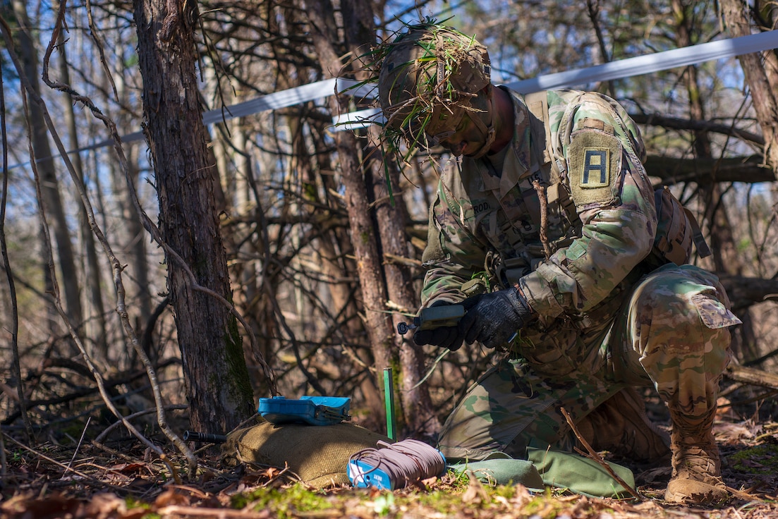 Sgt. 1st Class Ronald Roden prepares to employ a simulated M18 claymore mine during the 2021 Fort Knox and First Army Division East Best Warrior Competition.