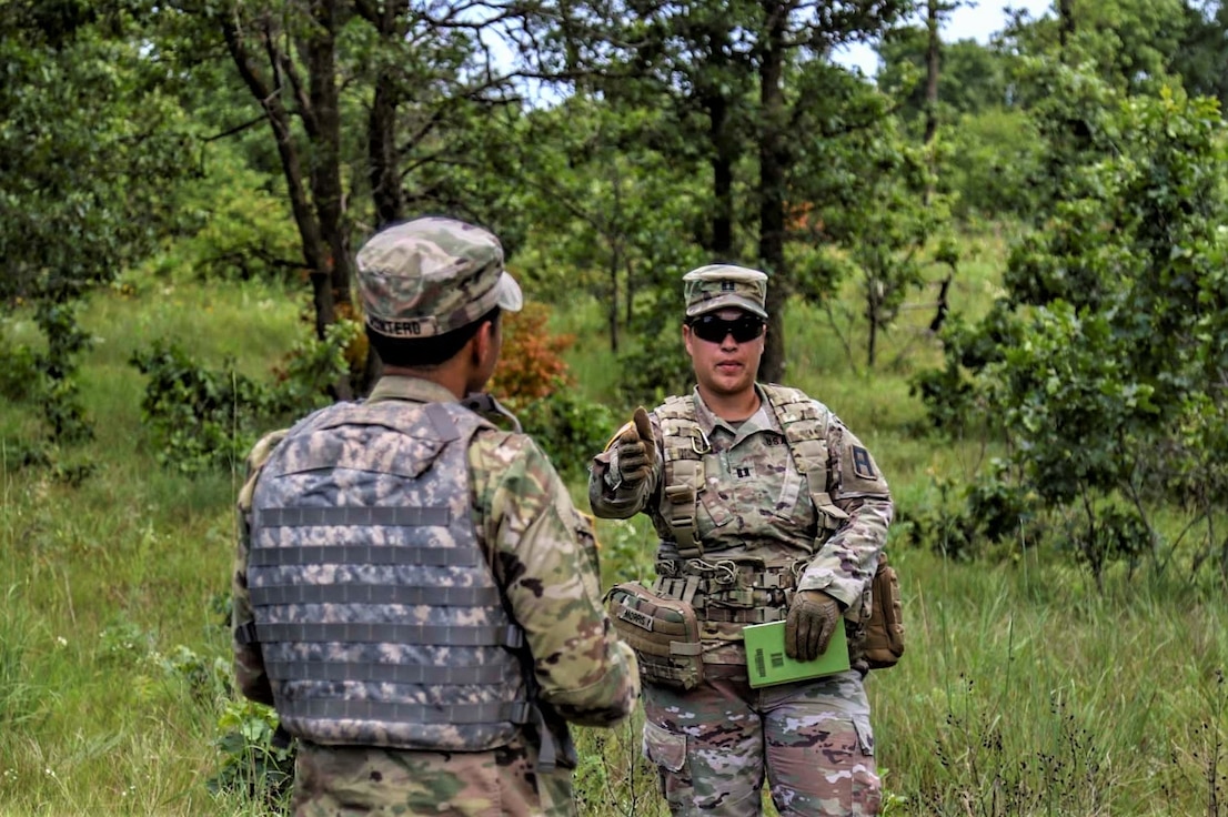 Capt Crystal Morris (right), an observer coach/trainer (OC/T) with 3rd Battalion, 409th Brigade Support Battalion, 4th Cavalry Multi-Functional Training Brigade, conducts an after action review