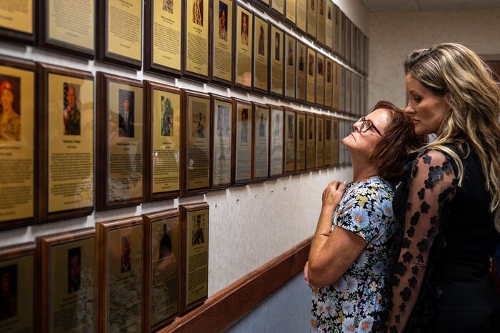 Woman looks at plaques