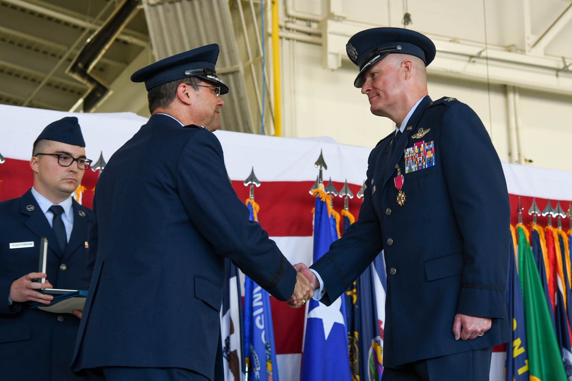 Col. Michael Walters relinquishes command of the 5th Bomb Wing to Col. Daniel Hoadley at Minot Air Force Base, N.D., June 23, 2022.