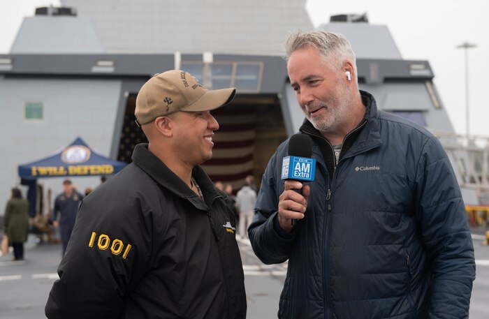 Operations Specialist 1st Class Christopher Jenkins, assigned to the Zumwalt-class destroyer USS Michael Monsoor (DDG 1001), answers a question during an interview with KOIN 6 News, aboard the ship during Portland Fleet Week 2022, June 9. Portland Fleet Week is a time-honored celebration of the sea services and provides an opportunity for the citizens of Oregon to meet Sailors, Marines and Coast Guardsmen, as well as witness firsthand the latest capabilities of today's maritime services (U.S. Navy Photo by Mass Communication Specialist 2nd Class Jasmine Suarez).