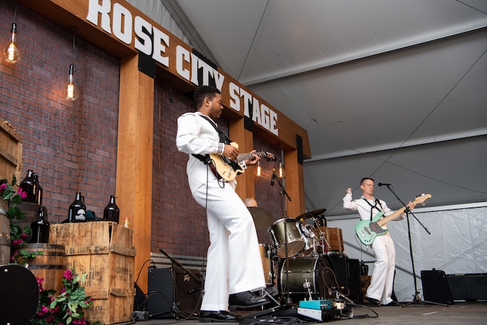 Musicians assigned to Navy Band Northwest perform during a live show at Tom McCall Waterfront Park during Portland Fleet Week in Oregon, June 10, 2022. Portland Fleet Week is a time-honored celebration of the sea services and provides an opportunity for the citizens of Oregon to meet Sailors, Marines and Coast Guardsmen, as well as witness firsthand the latest capabilities of today's maritime services. (U.S. Navy photo by Mass Communication Specialist Seaman Apprentice Sophia H. Brooks)