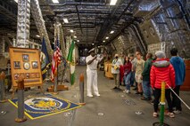 Chief Operations Specialist Brian Spear, assigned to the Independence-variant littoral combat ship USS Coronado (LCS 4), speaks to a tour group during Portland Fleet Week 2022, June 11. Portland Fleet Week is a time-honored celebration of the sea services and provides an opportunity for the citizens of Oregon to meet Sailors, Marines and Coast Guardsmen, as well as witness firsthand the latest capabilities of today's maritime services. (U.S. Navy photo by Mass Communication Specialist 2nd Class Victoria Galbraith)