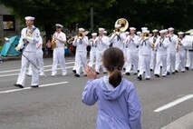 Sailors assigned to Navy Band Northwest, Passage perform at the Grand Floral Parade as part of the Portland Rose Festival and Fleet Week 2022, June 11. Portland Fleet Week is a time-honored celebration of the sea services and provides an opportunity for the citizens of Oregon to meet Sailors, Marines and Coast Guardsmen, as well as witness firsthand the latest capabilities of today's maritime services (U.S. Navy Photo by Mass Communication Specialist 2nd Class Jasmine Suarez).