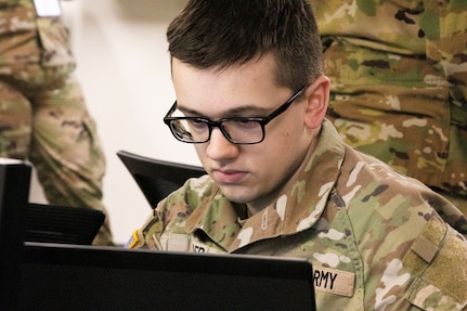 Spc. Nicholas Weber, a cyber operations specialist representing the Illinois National Guard, participates in Cyber Shield 2022 at Camp Robinson in North Little Rock, Arkansas June 10, 2022. Cyber Shield 2022 is the Department of Defense's largest unclassified inter-agency and joint national level training cyber defense exercise which includes representation from 20 states plus Guam. (U.S. Army photo by Illinois National Guard Sgt. Trenton Fouche)