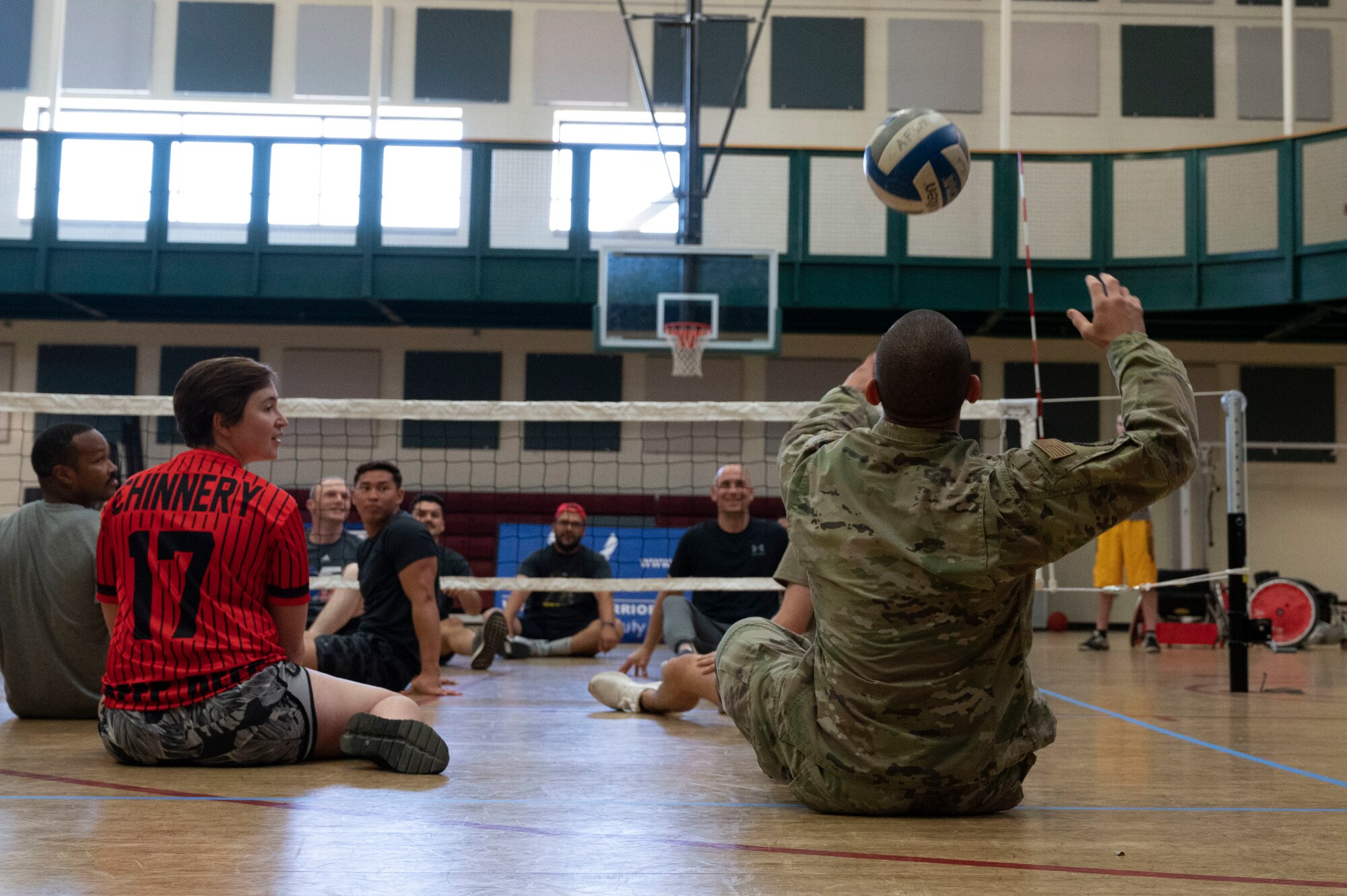 Several U.S. Airmen attempt sitting volleyball during an Air Force Wounded Warrior Program
(AFW2) immersion event at Laughlin Air Force Base, Texas, June 15, 2022. The AFW2 Program is a
Congressionally-mandated and Federally-funded organization tasked with taking care of U.S. Air Force
wounded, ill, and injured Airmen, Veterans, and their families. (U.S. Air Force photo by Airman 1st Class
Kailee Reynolds)