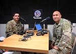 From left, Capt. Geoff Schultz, bilateral affairs officer, and Capt. Mario Rey, State Partnership Program director, New Hampshire National Guard, join the Your NH Guard studio in Concord to discuss New Hampshire's partnerships with El Salvador and Cabo Verde on June 15, 2022.