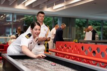 Representatives from the U.S. Navy and the Royal Canadian navy face off at the annual Galley Wars during Portland Fleet Week in Oregon, June 9, 2022. Portland Fleet Week is a time-honored celebration of the sea services and provides an opportunity for the citizens of Oregon to meet Sailors, Marines and Coast Guardsmen, as well as witness firsthand the latest capabilities of today's maritime services. (U.S. Navy photo by Mass Communication Specialist Seaman Apprentice Sophia H. Brooks)