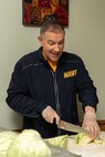 Lt. Phillip Webster, Navy Region Northwest chaplain, prepares meals for the local homeless community at the Share House in Vancouver, Washington during Portland Fleet Week, June 12, 2022. Portland Fleet Week is a time-honored celebration of the sea services and provides an opportunity for the citizens of Oregon to meet Sailors, Marines and Coast Guardsmen, as well as witness firsthand the latest capabilities of today's maritime services. (U.S. Navy photo by Mass Communication Specialist Seaman Apprentice Sophia H. Brooks)