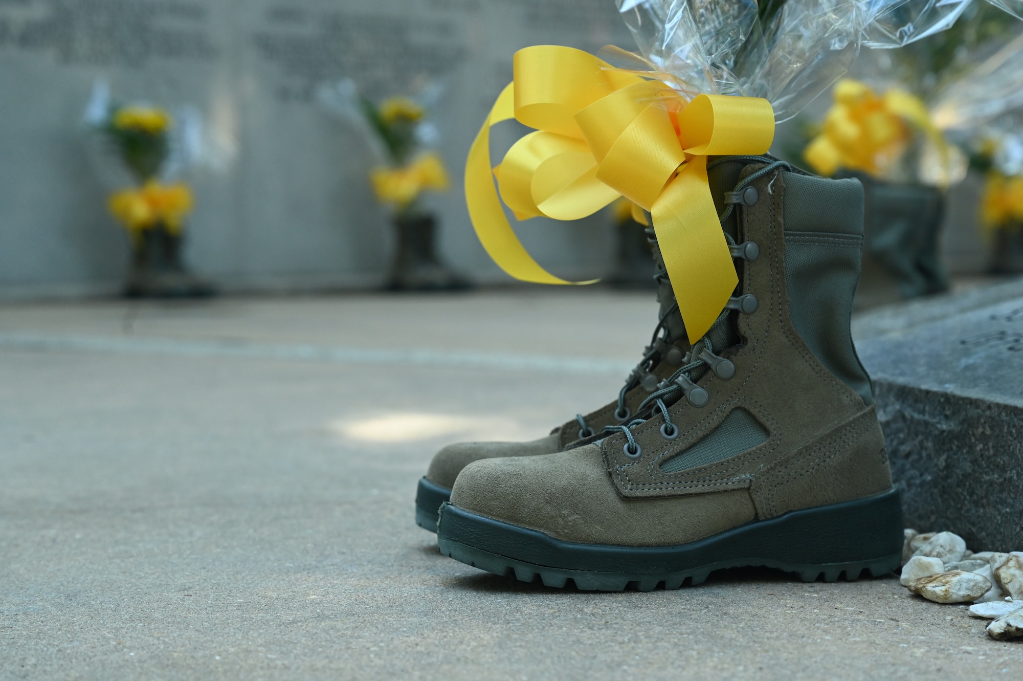 Members with the 33rd Fighter Wing place flowers to honor fallen members who lost their lives during the 26th Annual Khobar Towers Memorial Ceremony hosted by the 33rd Fighter Wing June 23, 2022, at Eglin Air Force Base, Florida, June 23, 2022.