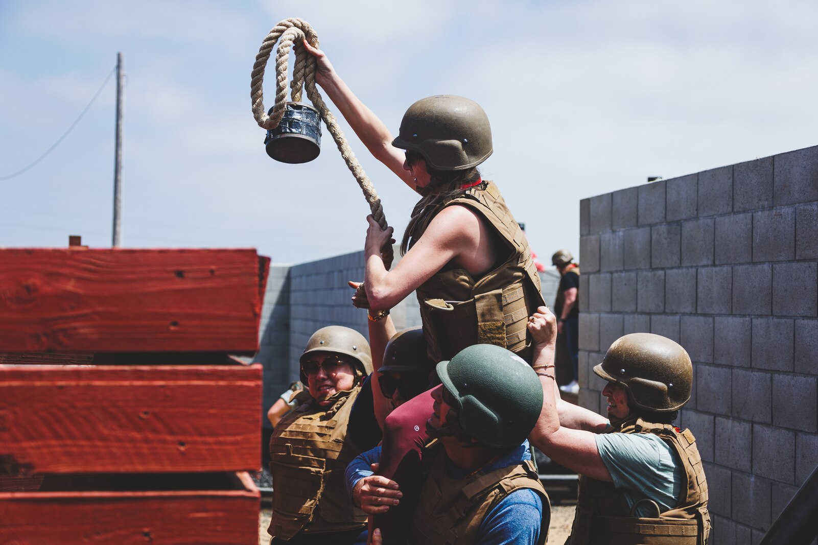 Educators with Recruiting Stations Los Angeles and Sacramento, maneuver obstacles on the Leadership Reaction Course during the Educators' Workshop at Edson Range, Camp Pendleton, California, June 15, 2022. The Educators' Workshop is a five-day program designed to better inform teachers, coaches, counselors and influencers about the benefits and opportunities available during service in the Marine Corps. This allows attendees to return home and provide firsthand experience and knowledge to individuals interested in military service. (U.S. Marine Corps photo by Sgt. Christian Cachola)
