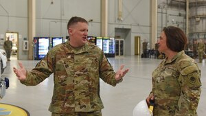 U.S. Air Force Brig. Gen. William Kale III, Air Force Director of Civil Engineers, and 17th Training Wing members observe an evaluation test performed by Airman Cayden Shelton, 312th Training Squadron student, at Goodfellow Air Force Base, Texas, June 23, 2022. Kale presented Shelton with a challenge coin for his demonstration of strength and endurance. (U.S. Air Force photo by Airman 1st Class Zachary Heimbuch)