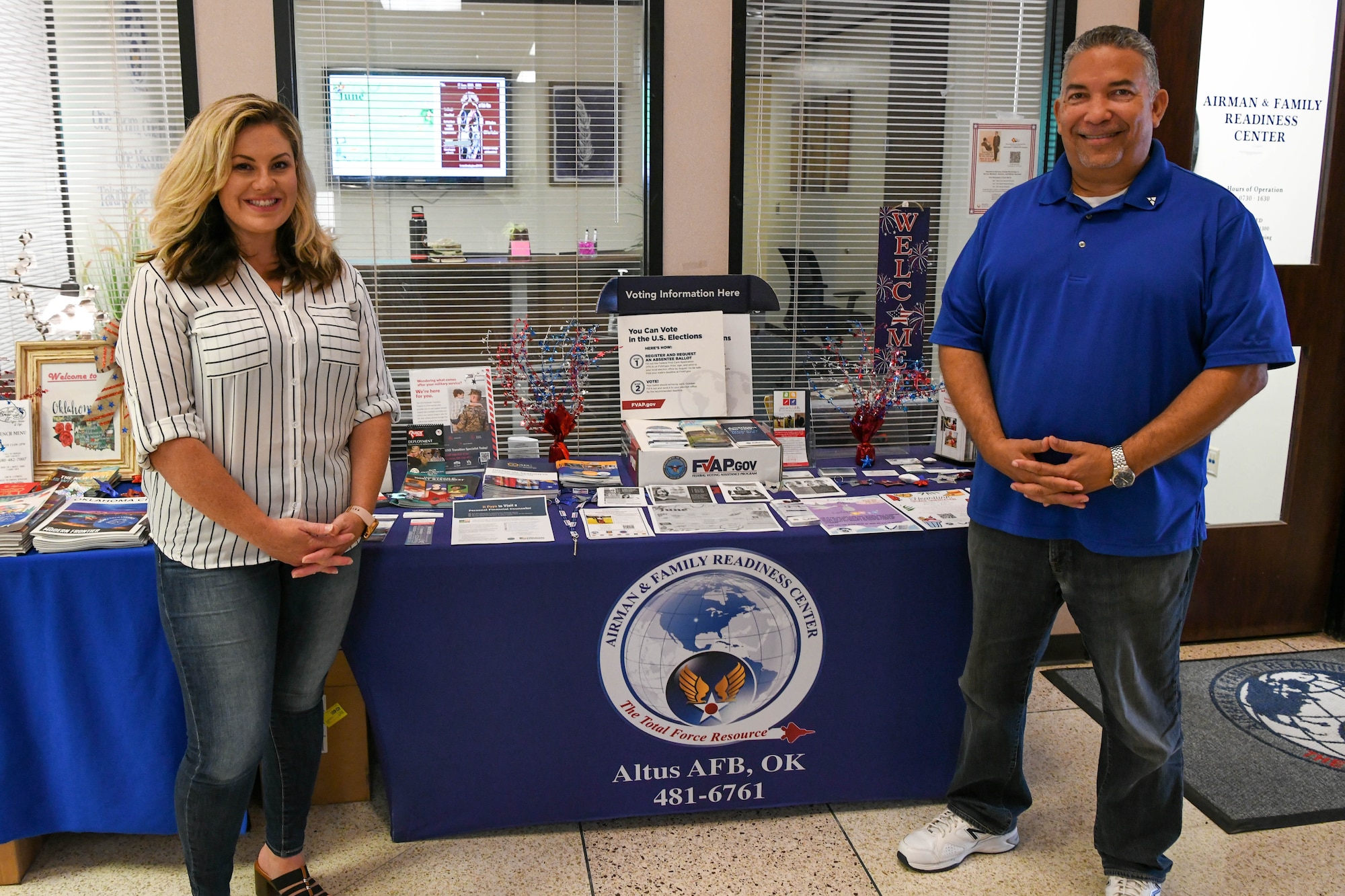 Leah Pretulak (left), 97th Force Support Squadron (FSS) personal financial counselor, and Jerome Davis, 97th FSS community readiness consultant pose for a photo at Altus Air Force Base, Oklahoma, June 14, 2022. The Airman and Family Readiness Center provides several readiness programs to lessen the amount of personal hardships affecting Airmen and helps ensure the 97th Air Mobility Wing mission continues. (U.S. Air Force photo by Airman 1st Class Trenton Jancze)