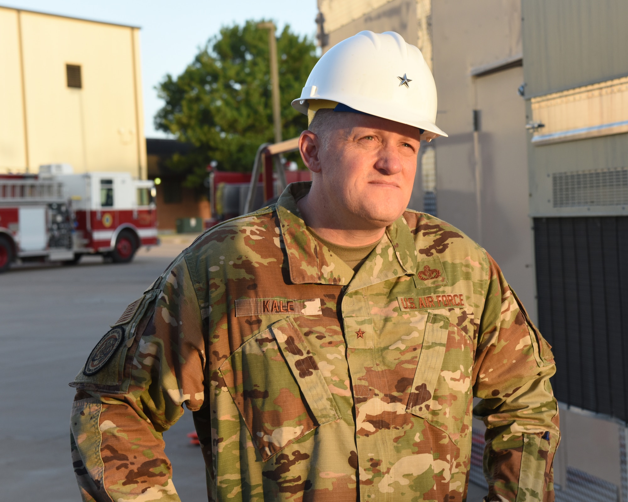U.S. Air Force Brig. Gen. William Kale III, Air Force Director of Civil Engineers, watches as 312th Training Squadron students perform ladder training at Goodfellow Air Force Base, Texas, June 23, 2022. During his visit, Kale toured Goodfellow’s facilities and observed fire protection training.  (U.S. Air Force photo by Airman 1st Class Zachary Heimbuch)