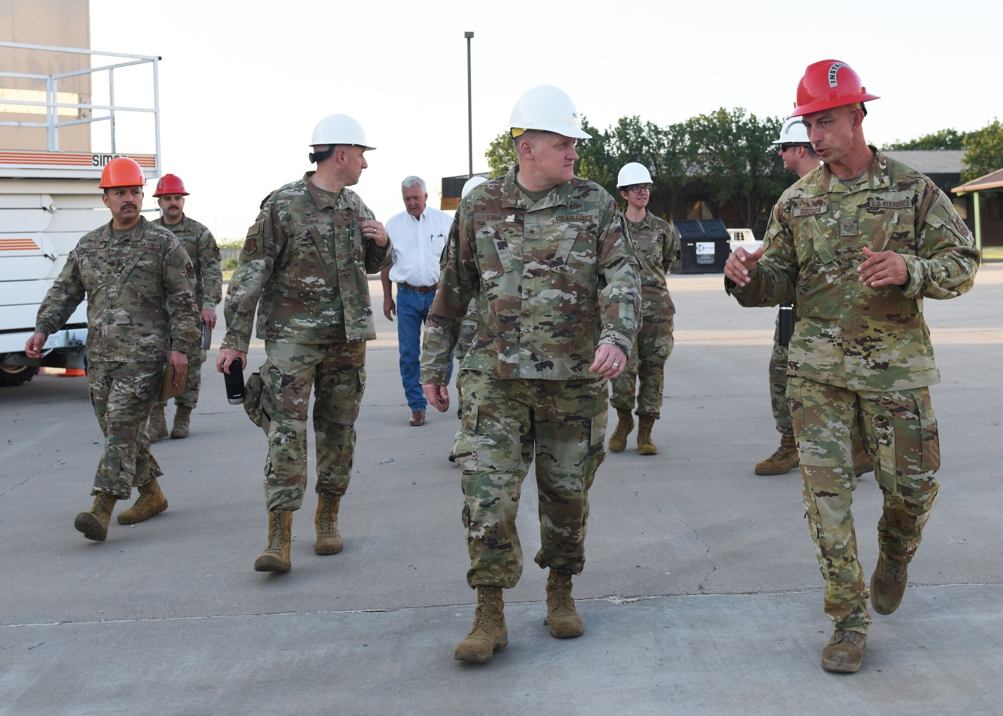 U.S. Air Force Brig. Gen. William Kale III, Air Force Director of Civil Engineers, gets a tour of Louis F. Garland Department of Defense Fire Academy from Tech. Sgt. Eugene Dotson, 312th Training squadron instructor supervisor, at Goodfellow Air Force Base, Texas, June 23, 2022. The 312th Training Squadron is DoD’s training source for fire emergency services and scientific applications specialists. (U.S. Air Force photo by Airman 1st Class Zachary Heimbuch)