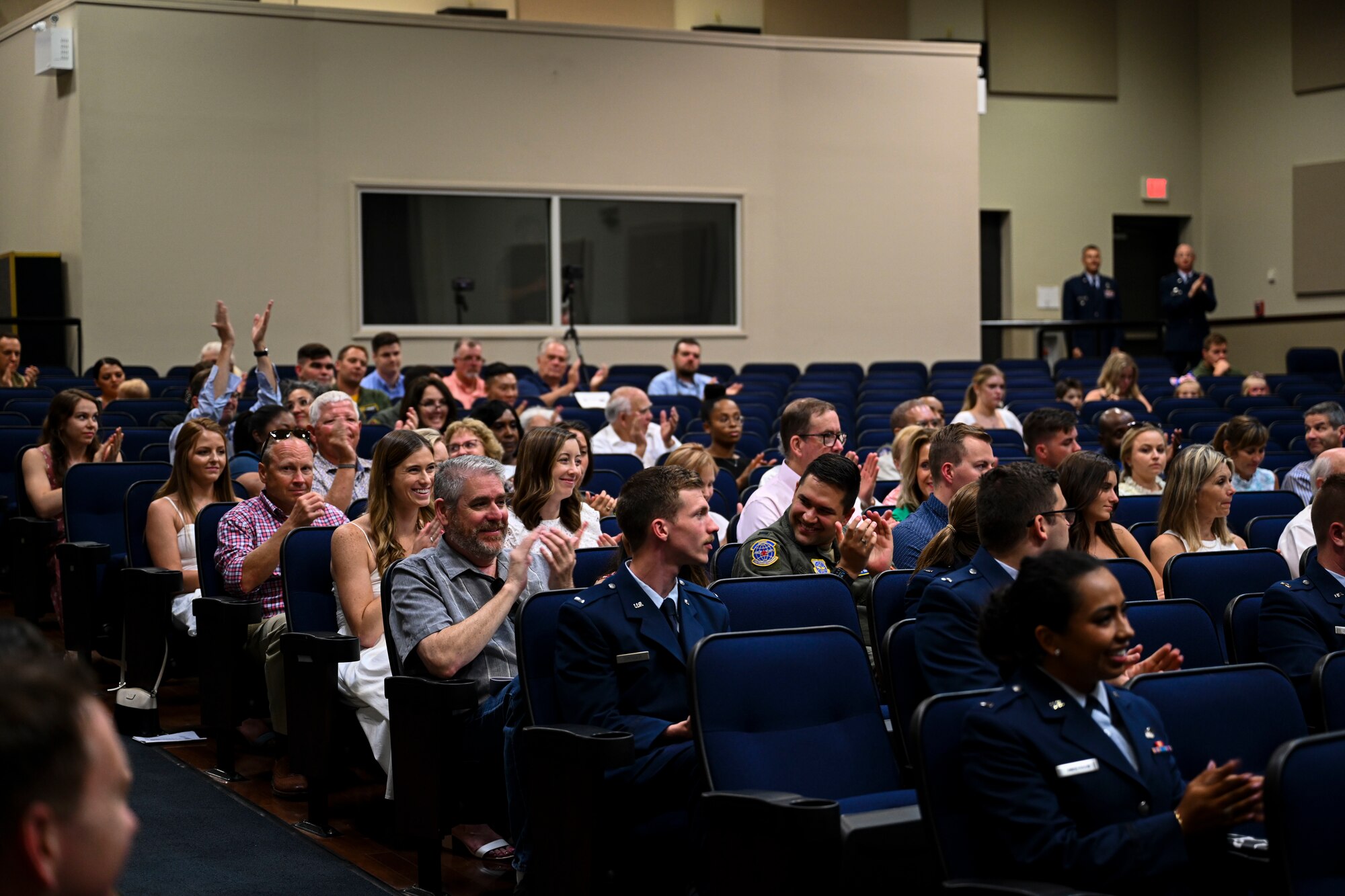 Guests of the graduating Specialized Undergraduate Pilot Training class 22-11 applaud as the speaker thanks the new pilots for their time, dedication, and attention to detail, June 17, 2022, on Columbus Air Force Base, Miss. Friends and family members applauded, cried, and hollered out for their pilot.  (U.S. Air Force photo by Airman 1st Class Jessica Blocher)