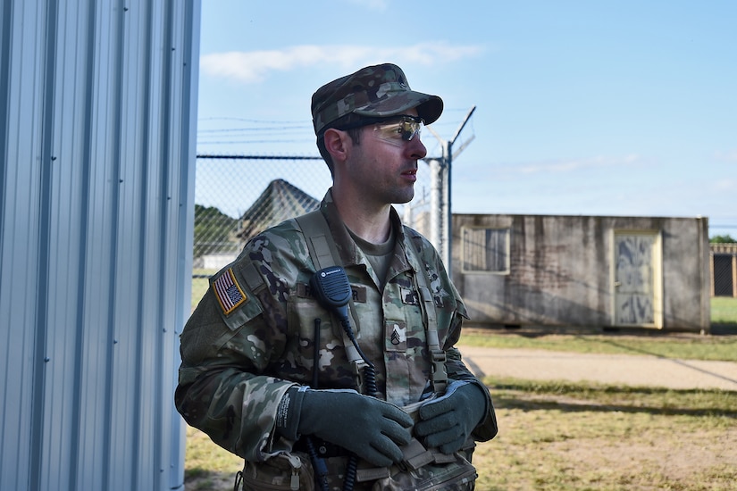 U.S. Army Reserve Staff Sgt. Ian Fairweather, Observer Coach/ Trainer, 1-338th Training Support Battalion, 85th U.S. Army Reserve Support Command, observes the training area during the Spartan Warrior Three training exercise at Fort McCoy, Wisconsin, June 19, 2022.