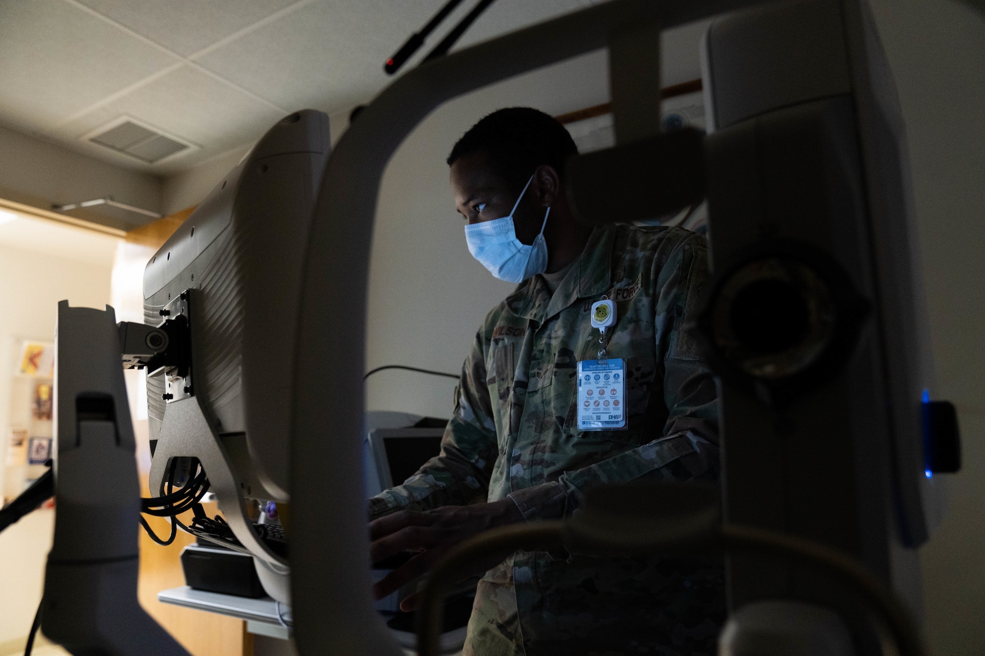 Senior Airman Denzel Wilson, 15th Operational Medical Readiness Squadron optometry technician, operates a retinal camera at the optometry clinic at Joint Base Pearl Harbor-Hickam, Hawaii, June 16, 2022. Eye exams and detailed photographs of the retina accurately document and track health changes to the eyes throughout the years. (U.S. Air Force photo by Airman 1st Class Makensie Cooper)